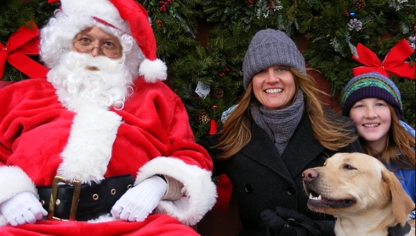 While we wrap your tree you can get a family pic. with Santa